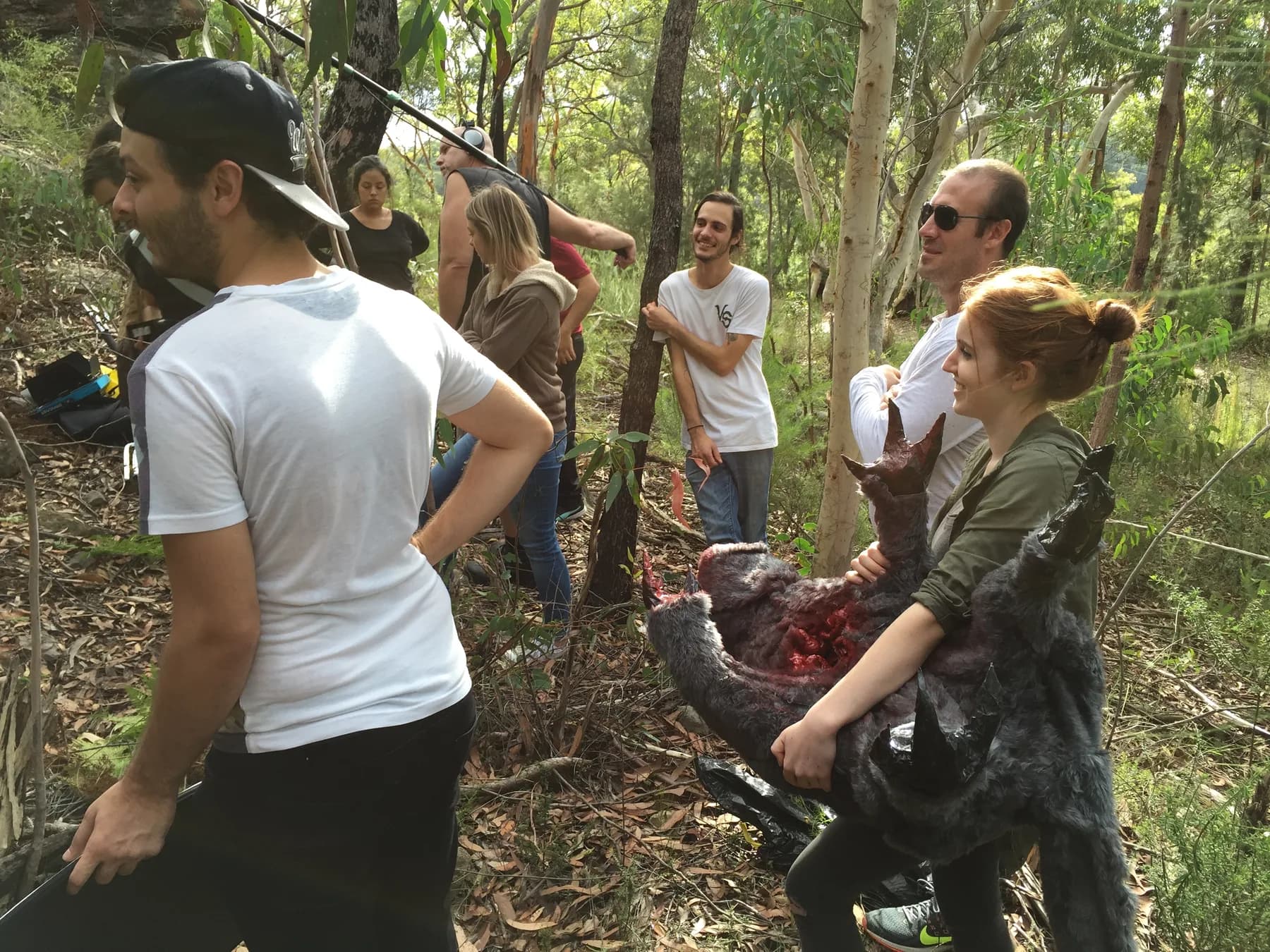 Cast and crew gathered in the forest