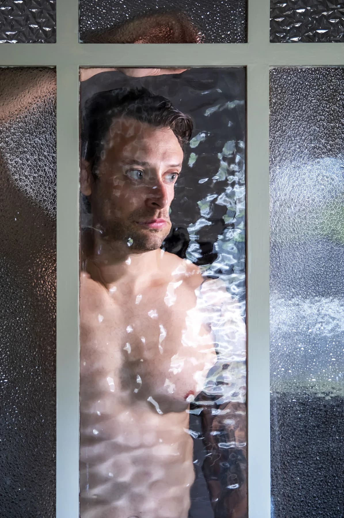 Chris Schofield seen through rippled glass
