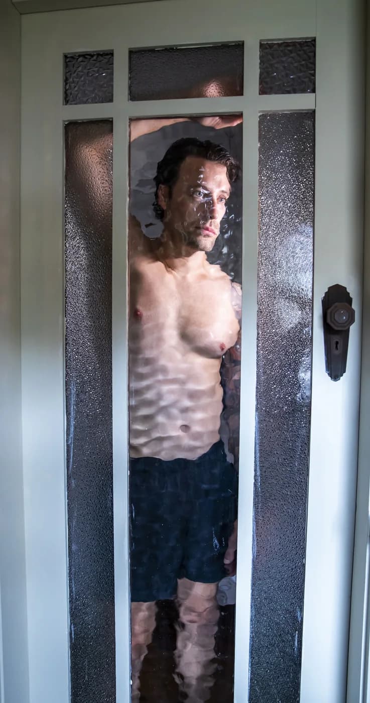 A figure distorted by rippled glass