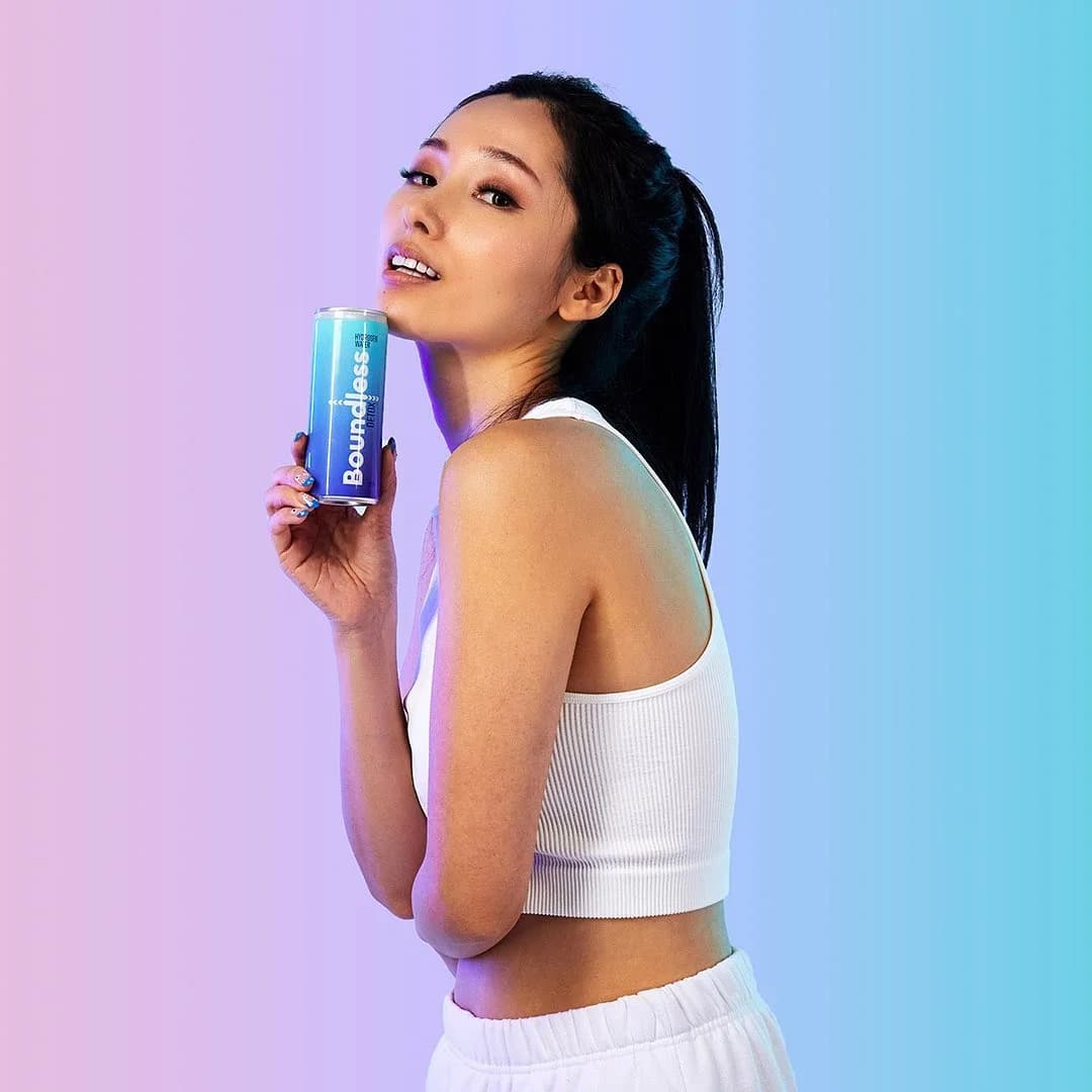 Boundless lifestyle portrait against a purple and blue studio background