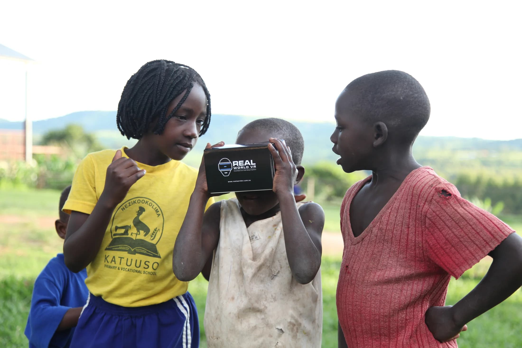 Children in Uganda discovering a VR headset made for the School for Life documentary