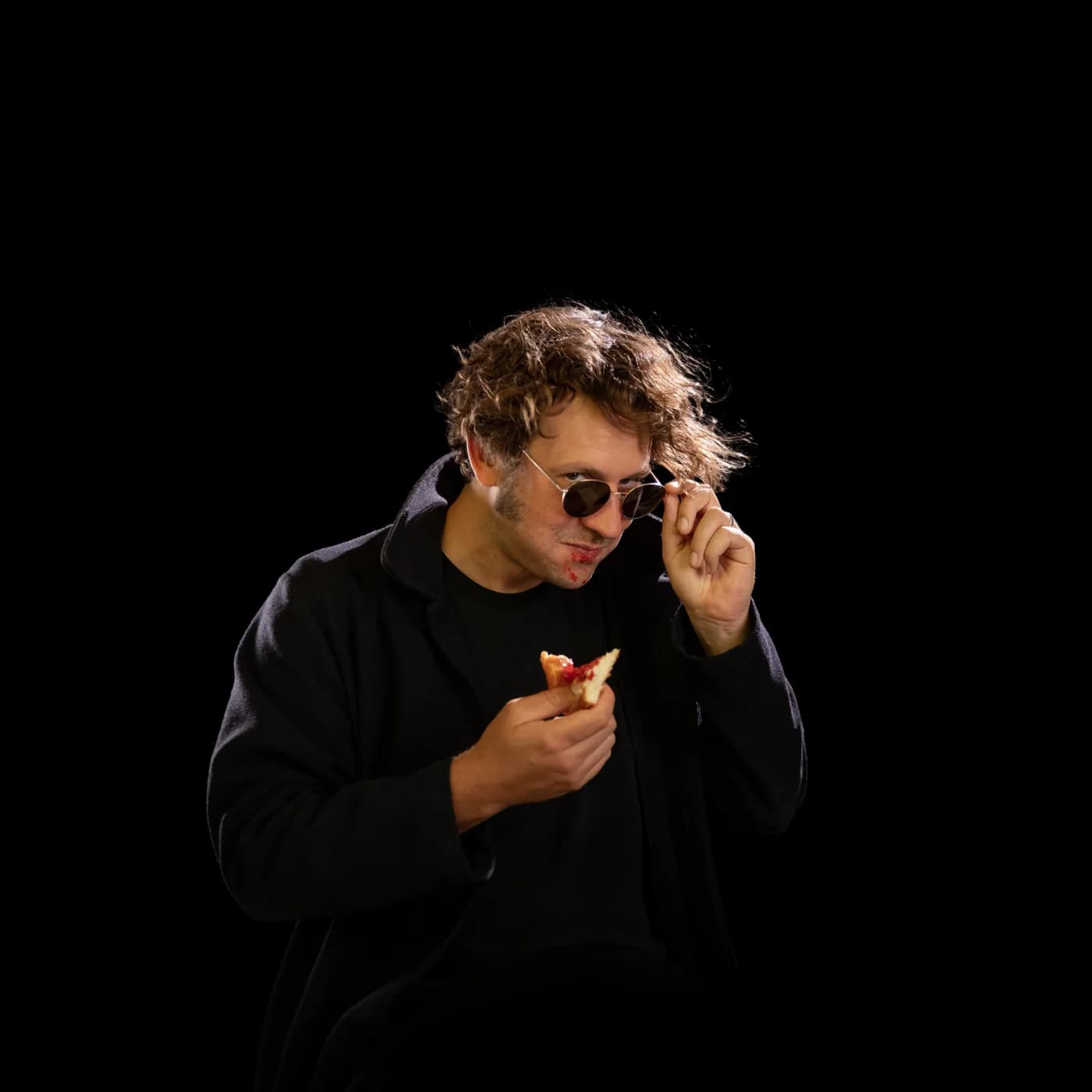 Harvey Pink adjusting sunglasses