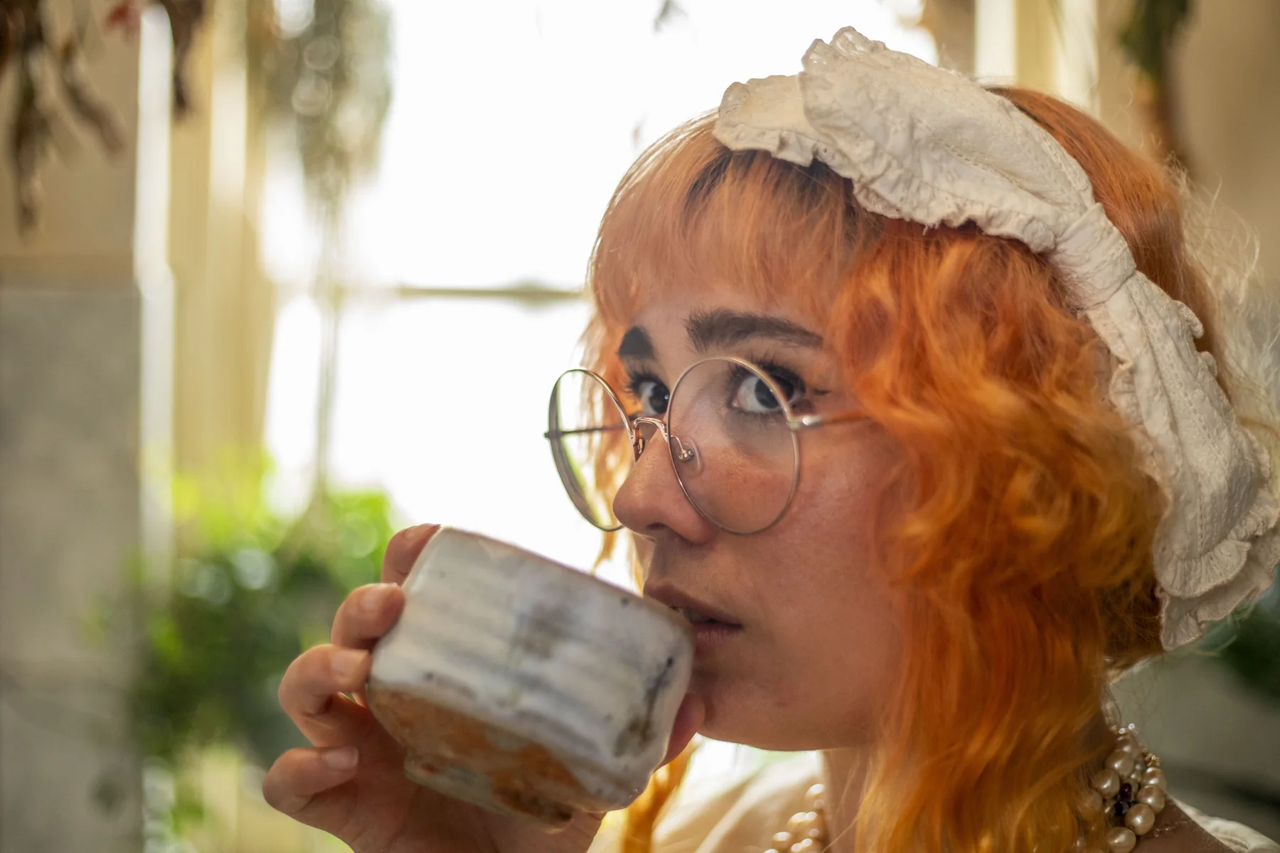 Inge drinking tea in the kitchen