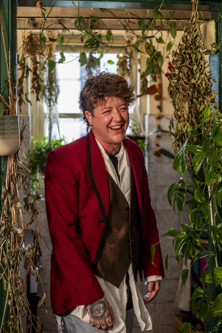 Ollie laughing among the plants