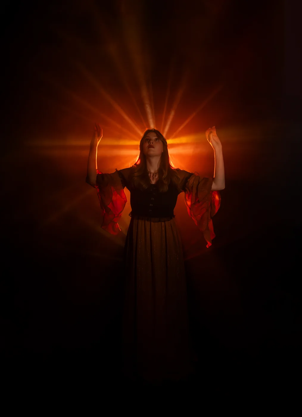 Sadie Mustoe framed by orange backlight